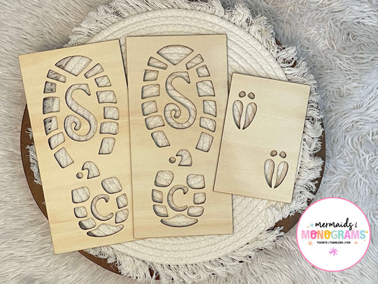 Wooden stencils with letter 'S' and 'C' designs on a textured surface.