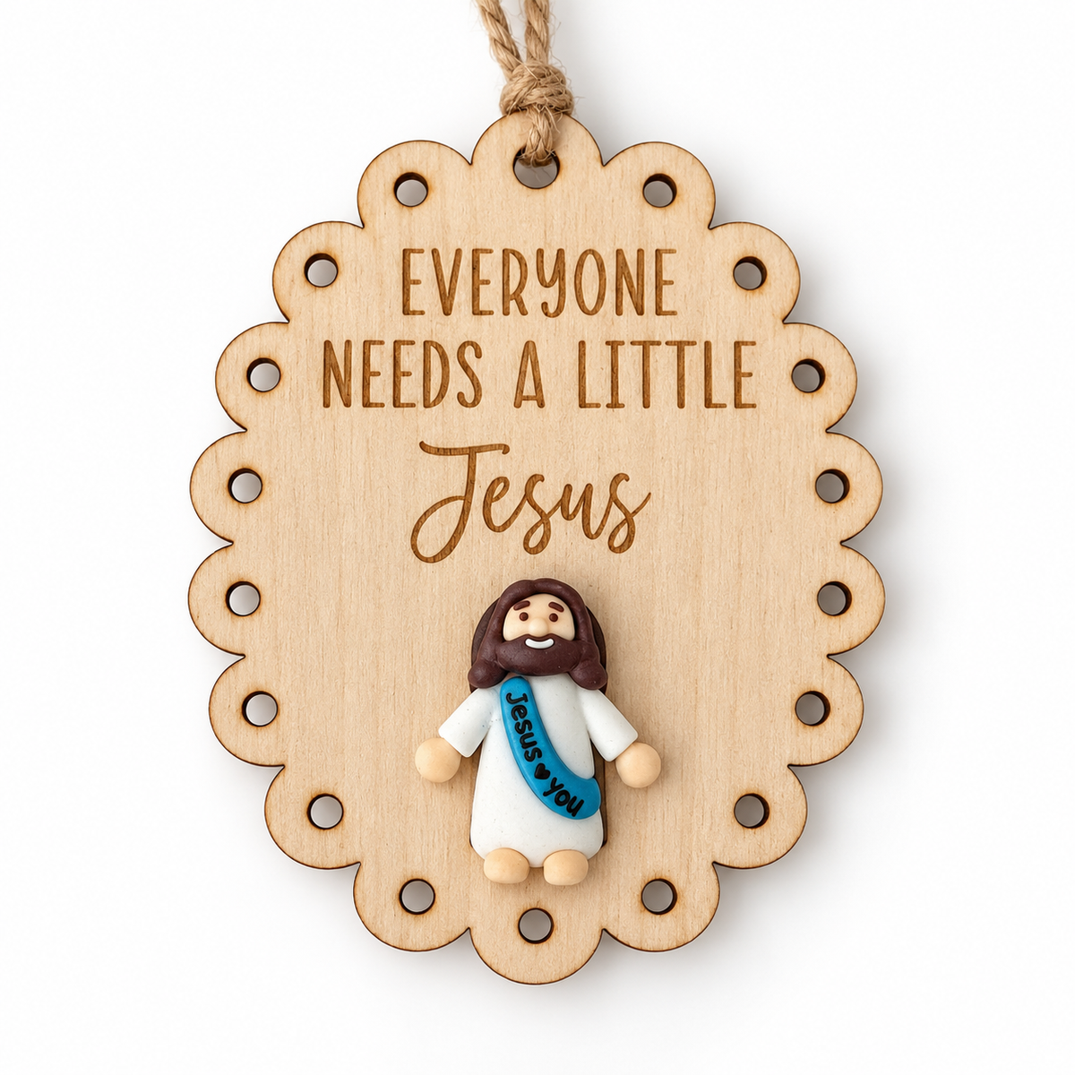 Scalloped Everyone Needs a Little Jesus wooden ornament with mini Jesus figure and rustic twine
